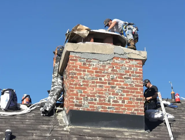 Clinton Chimney Sweep installing a custom chimney crown in Clinton, MA