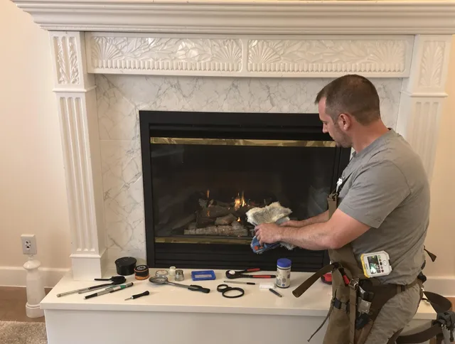 Clinton Chimney Sweep performing fireplace maintenance in Clinton, MA